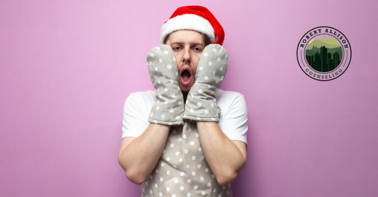 Man with anxiety in a Santa hat trying to navigate the holidays.