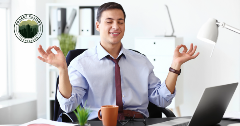 Man doing too much in an office trying to stay calm