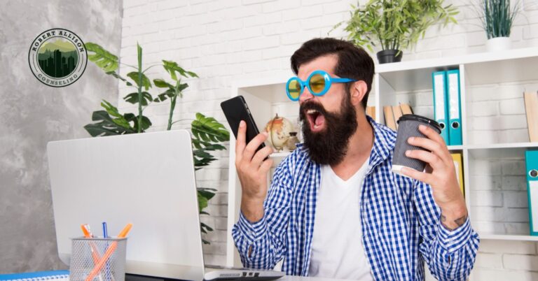 Anxious man taking on too many tasks as desk