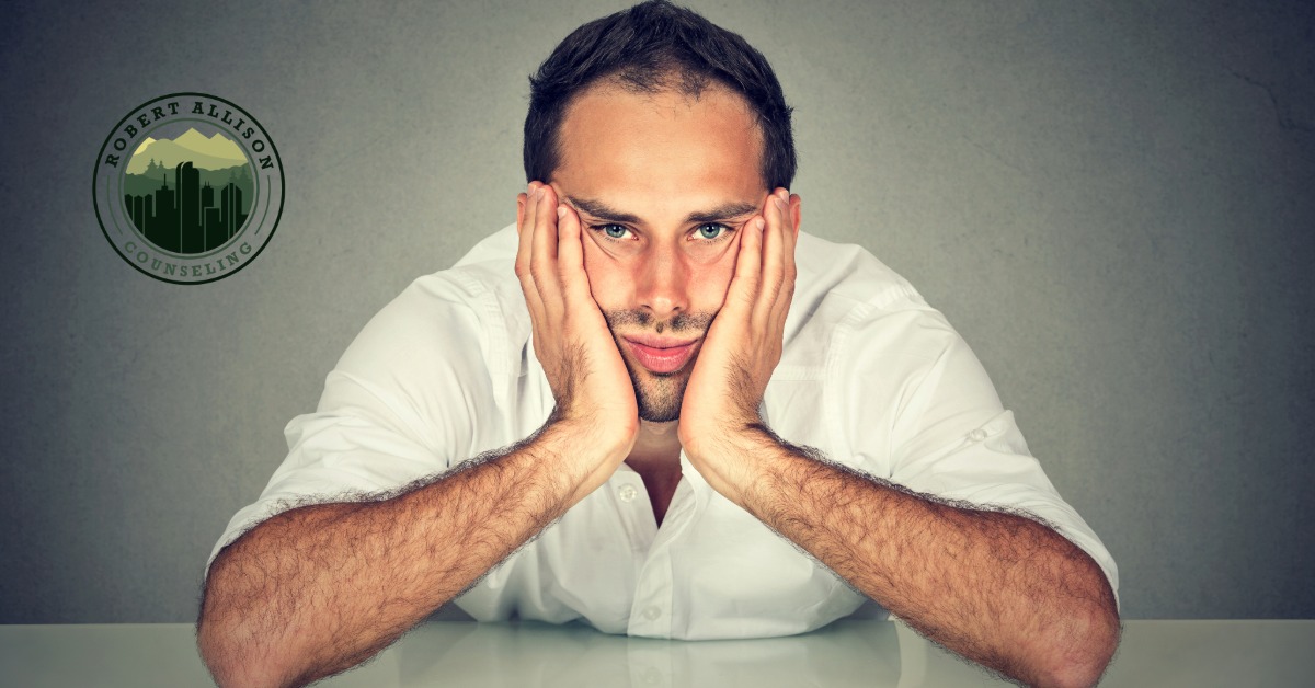 man looking disinterested